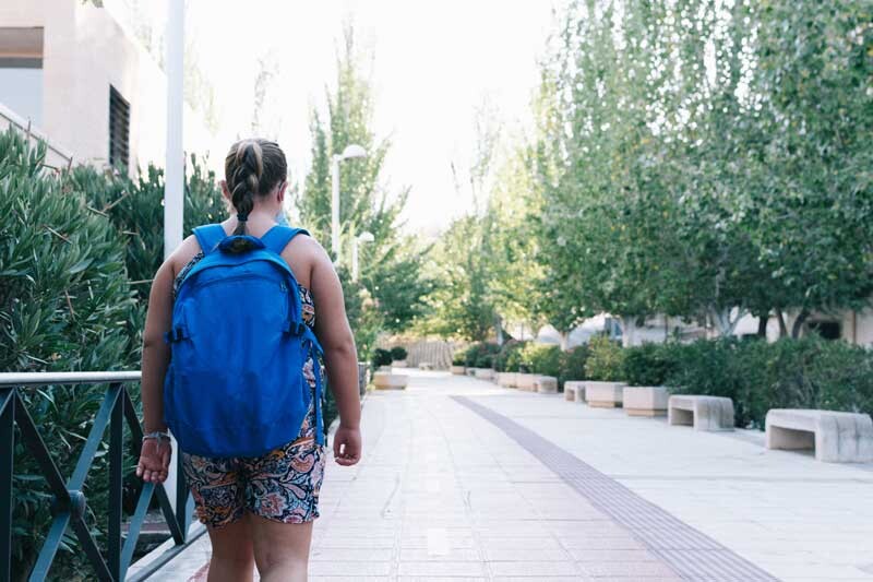 blonde-girl-with-blue-backpack